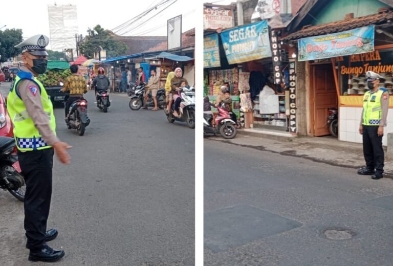 Personil Polsek Samarang Melakukan Pengaturan Lalu Lintas Pada Sore Hari.